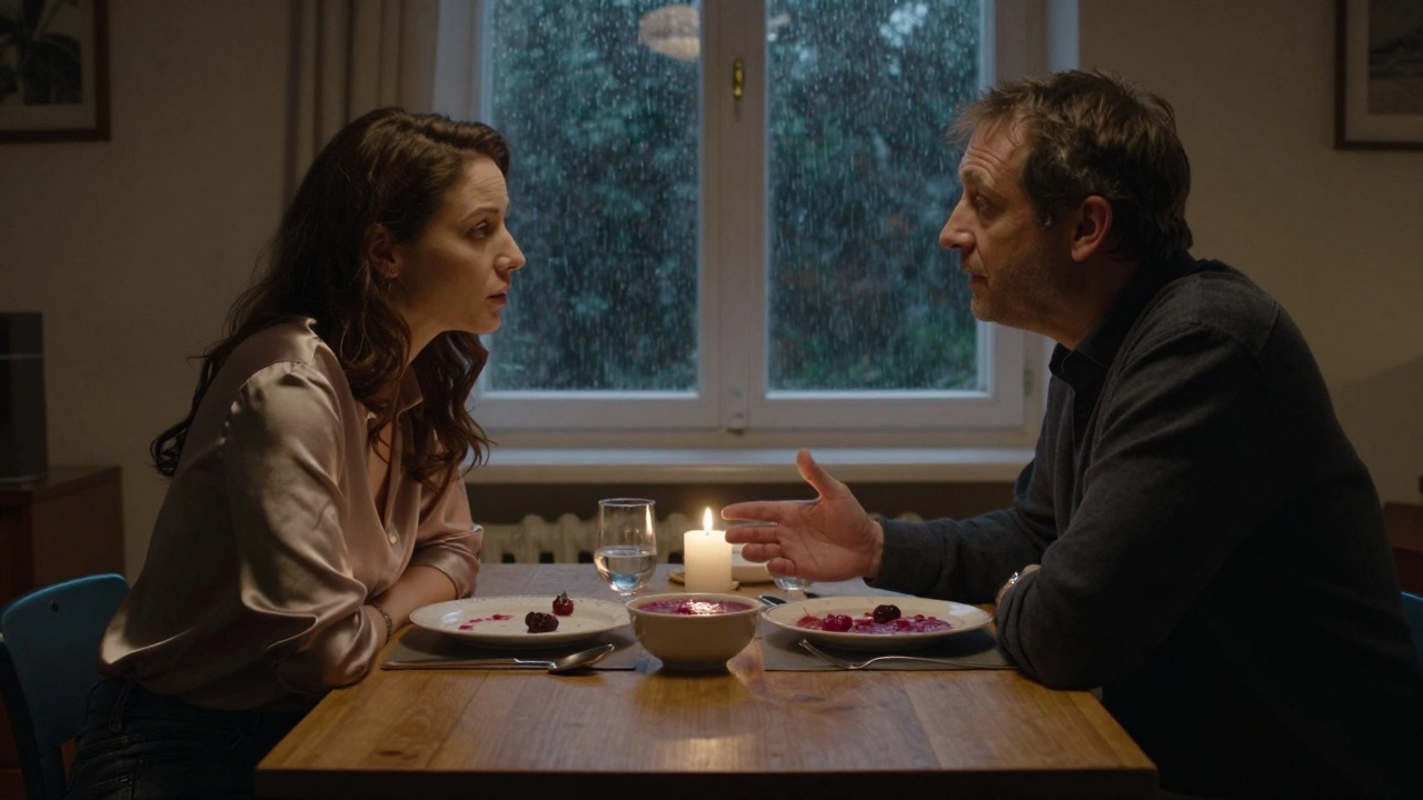 A woman listens intently to a man at a candlelit dining table, with borscht and rain on the window behind them.